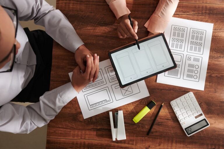 UI and UX Designers Discussing Project